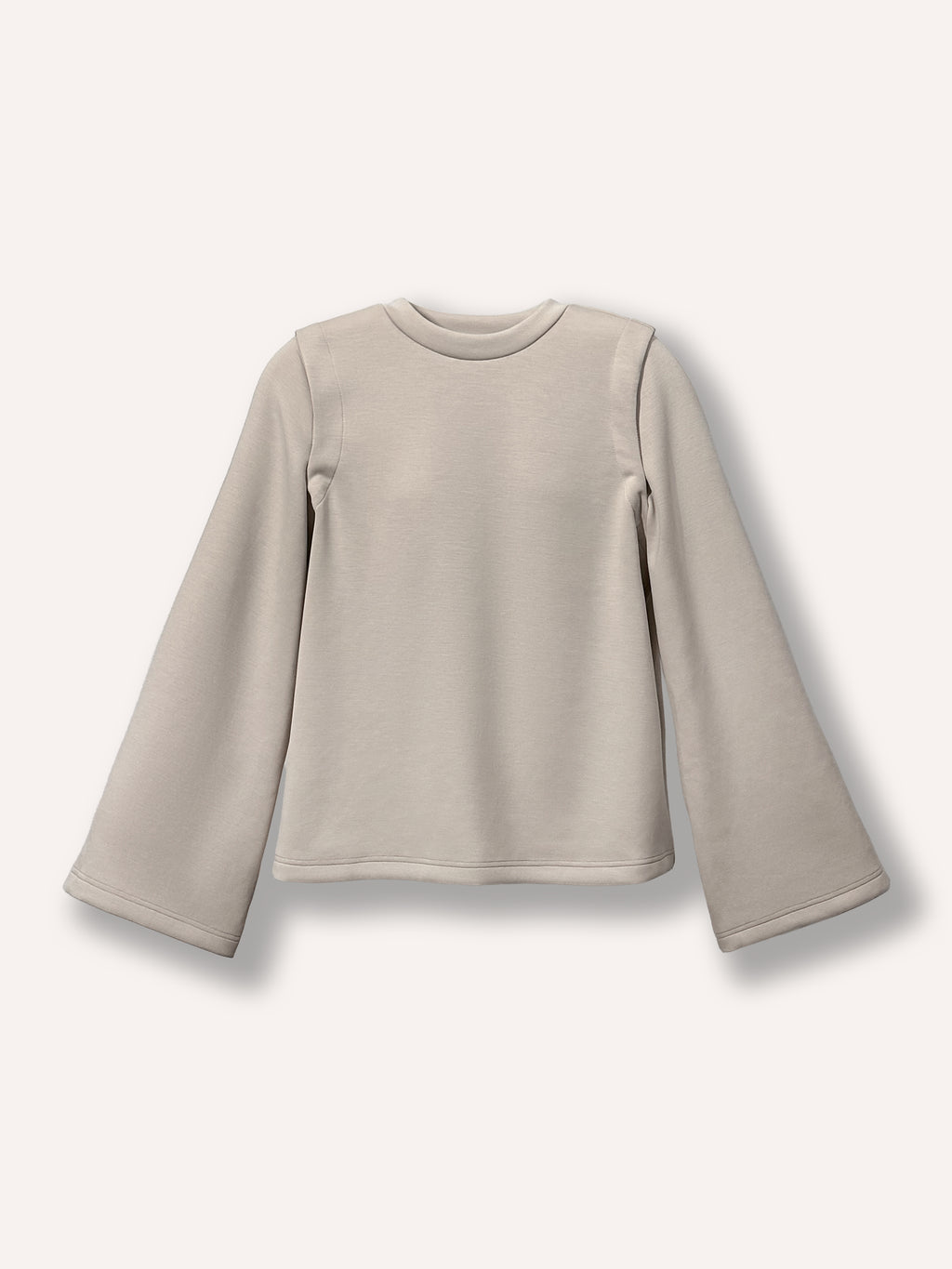 Chandail beige ample pour femme à manches amovibles et col rond, tissu confortable et extensible. Parfait pour femmes de 25 à 35 ans cherchant un vêtement moderne, pratique et polyvalent pour toutes les occasions.