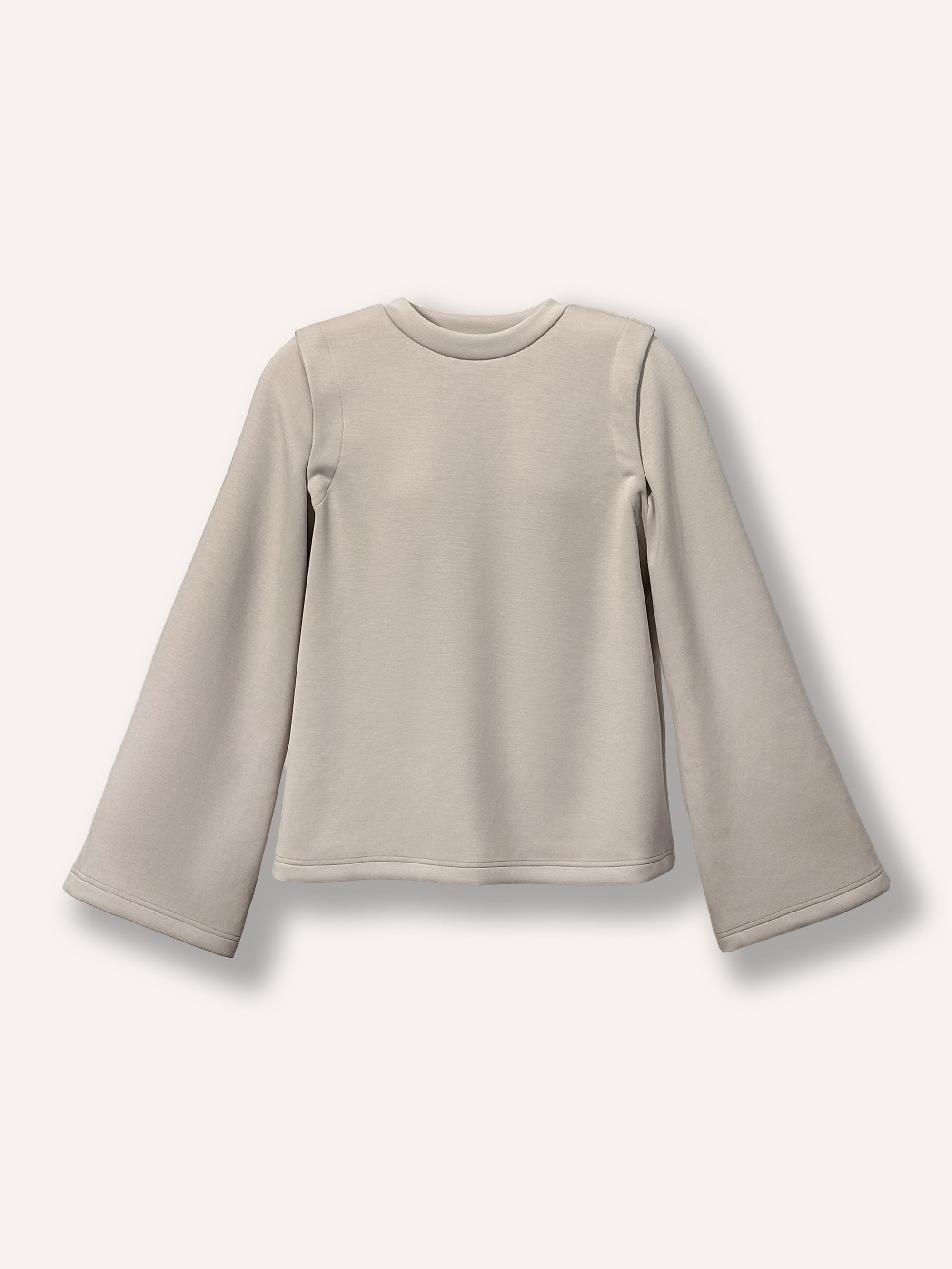 Chandail beige ample pour femme à manches amovibles et col rond, tissu confortable et extensible. Parfait pour femmes de 25 à 35 ans cherchant un vêtement moderne, pratique et polyvalent pour toutes les occasions.