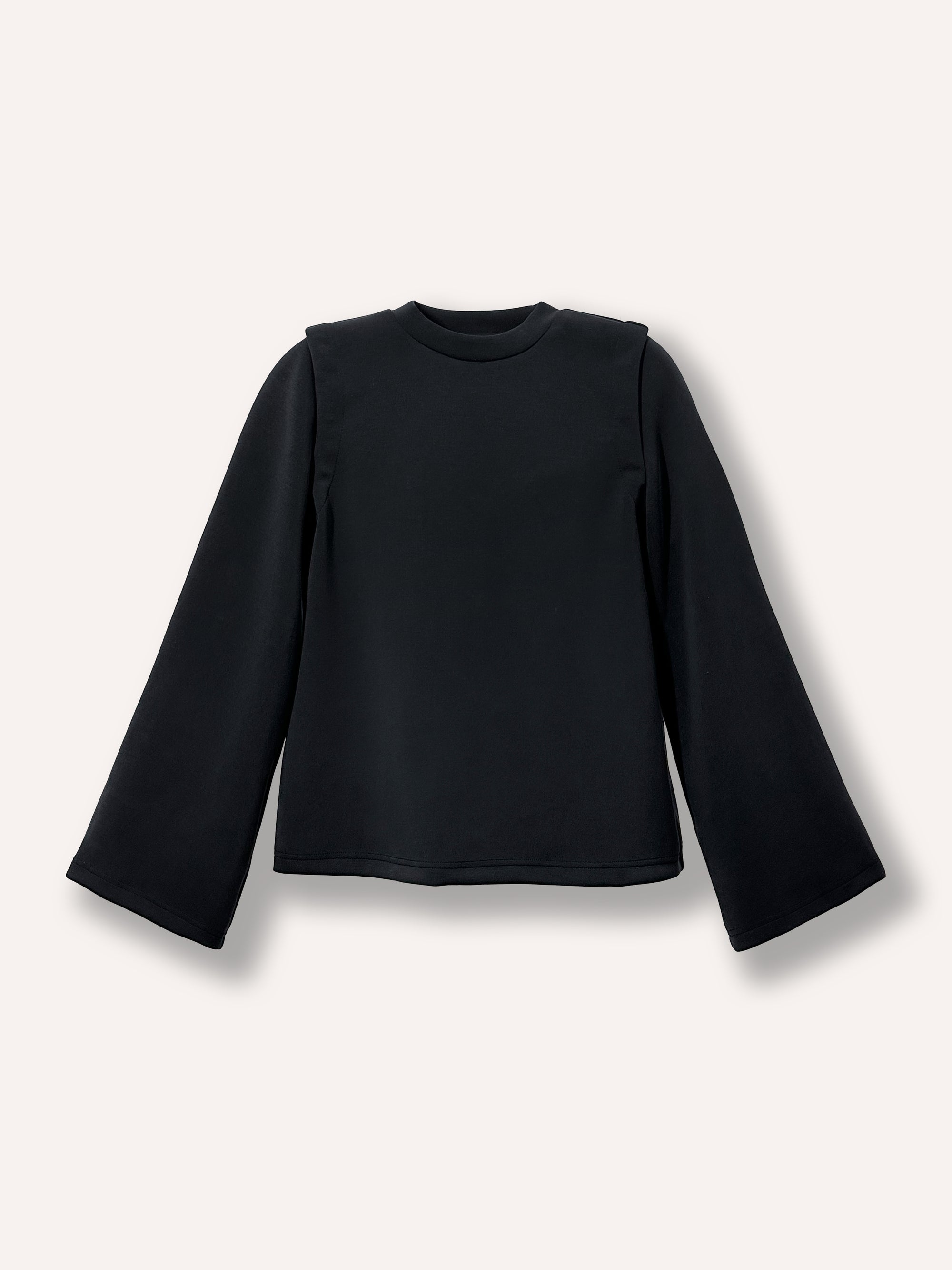 Chandail noir ample pour femme à manches longues amovibles et manches larges, avec col rond. Confectionné dans un tissu confortable et extensible, il offre une coupe décontractée et tendance, idéale pour un style moderne, polyvalent et facile à porter au quotidien.